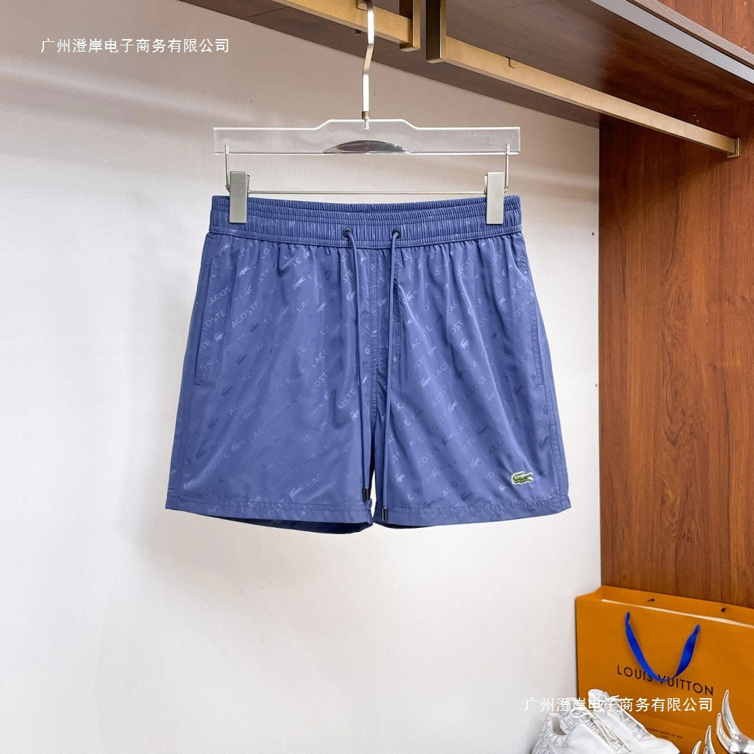 Nuevos pantalones cortos de playa para verano, pantalones deportivos casuales de secado rápido, estilo masculino holgado en stock, otras marcas