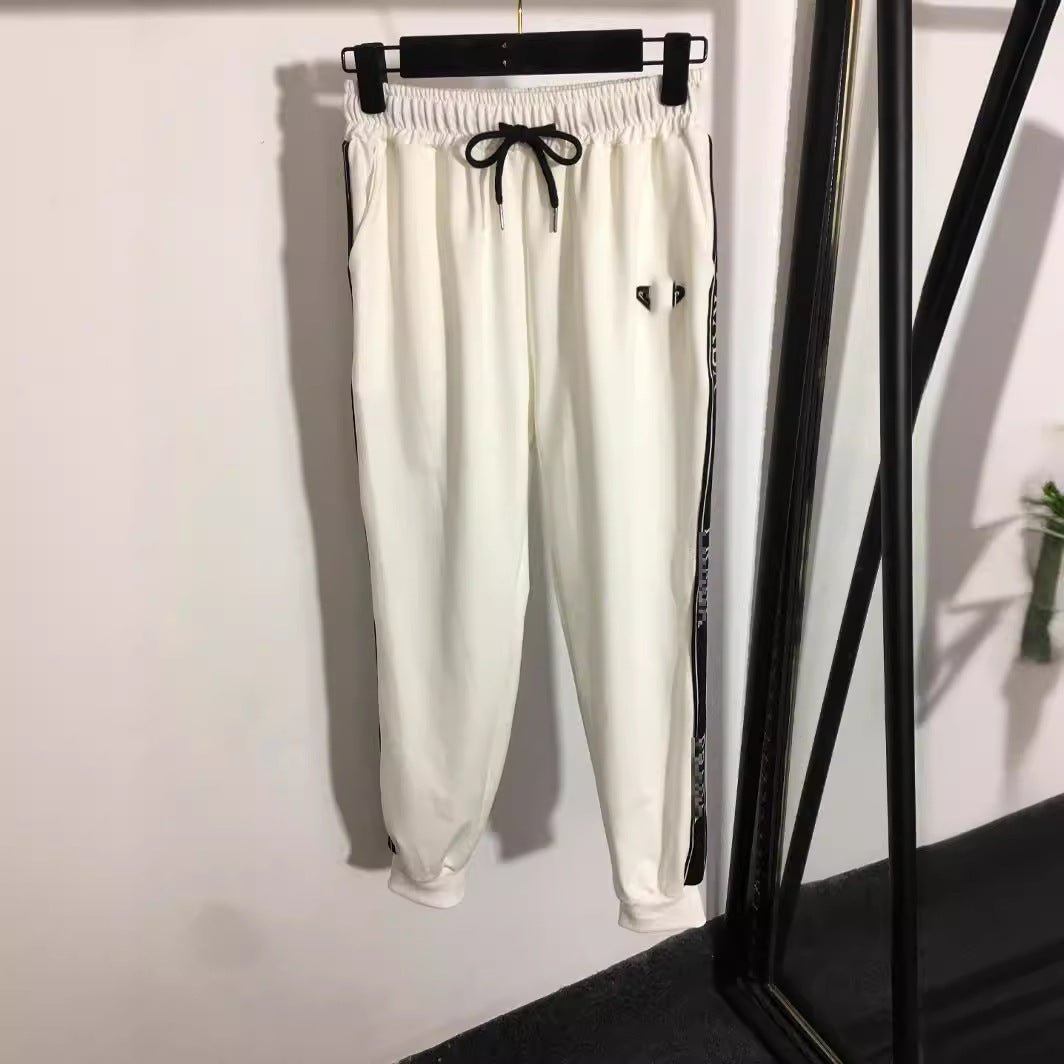 Chaqueta de camiseta de manga larga con cremallera + borde de cinta con cintura elástica de cintura y pantalones casuales de la Nanyou de alta gama triángulo