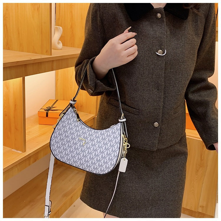 Bolsa de axilas para mujer 2025, nueva y de moda francesa de nicho de alta gama, bolso cruzado de un hombro y media luna