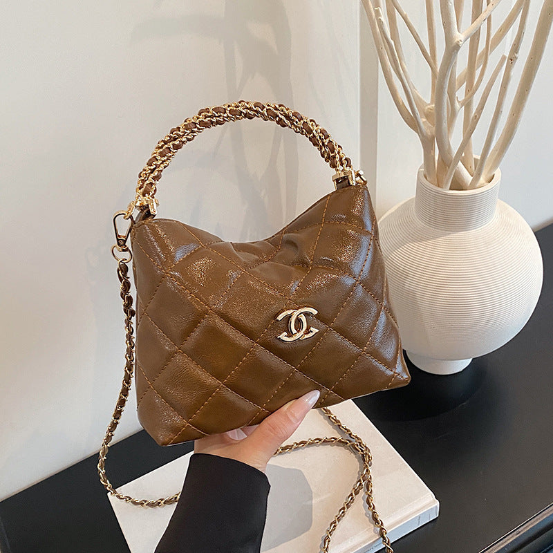 Nuevo bolso de cadena de diamante, bolso de asa torcida Xiangjia, bolso de mujer moderno, bandolera de un solo hombro, bolso de cubo vintage de cuero encerado
