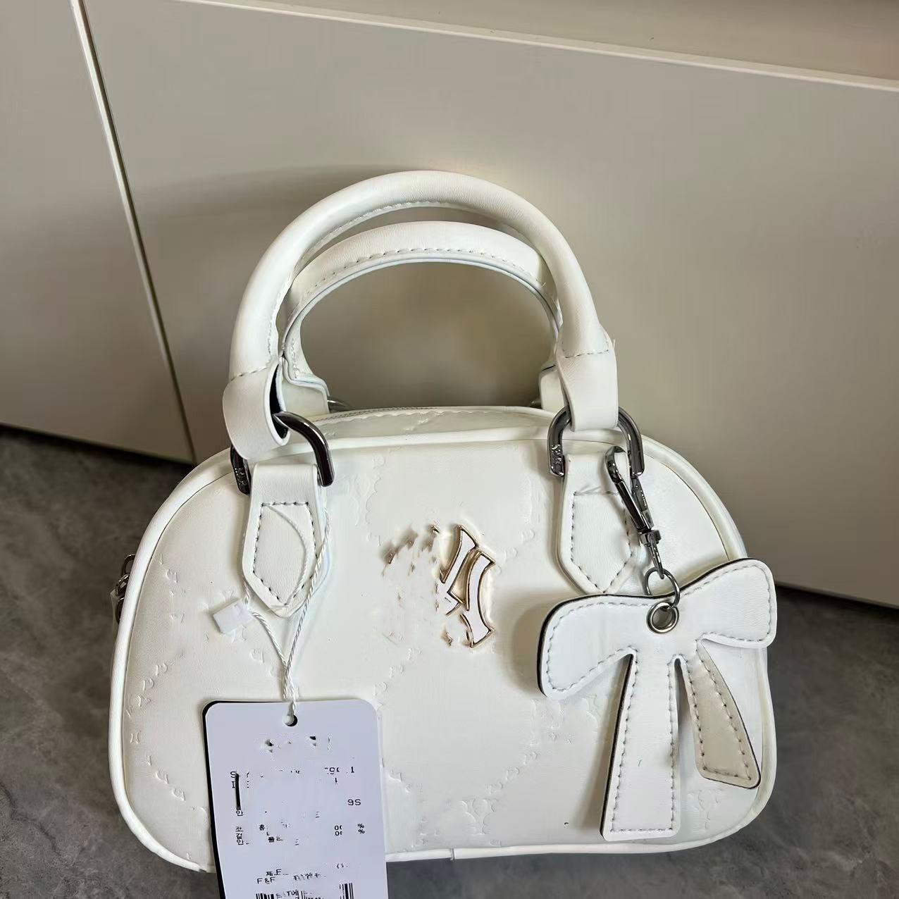 Bolsa de bolos nueva para ML coreana transfronteriza colgante, bolso de un solo hombro, bolso de mano, bolso versátil de moda, bolso de comercio exterior para mujeres