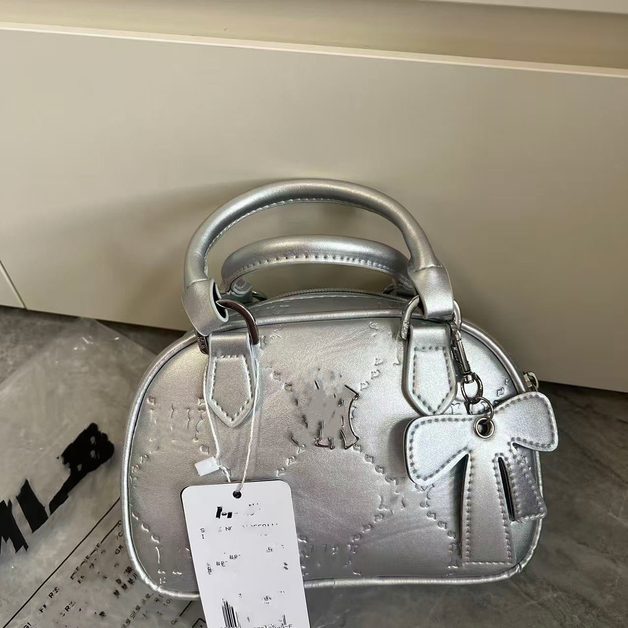Bolsa de bolos nueva para ML coreana transfronteriza colgante, bolso de un solo hombro, bolso de mano, bolso versátil de moda, bolso de comercio exterior para mujeres