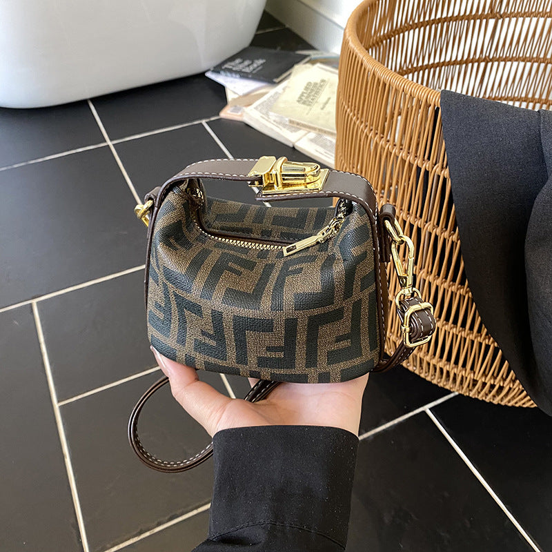 Bolso mini de dumplings de vaquero transfronterizo, bolso ligero de lujo de alta gama, versátil y de moda, bolso de mujer, bolso bandolera infantil de nicho coreano