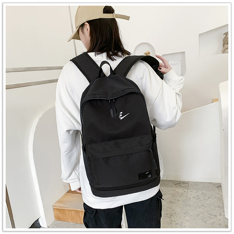 Una mochila de nylon moderna de dropshipping, mochila estampada de gran capacidad y con estampado elegante, mochila de estudiante universitario con alfabeto para la vuelta al cole