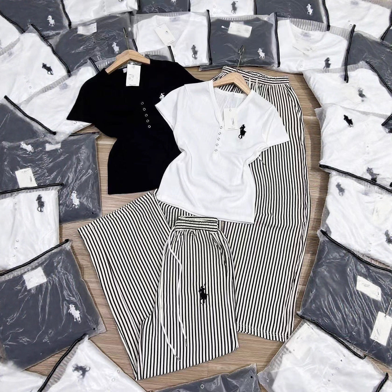 Conjunto de moda de comercio exterior para verano femenino, nuevo diseño con bordado en V con escote en V, pantalones de manga corta a rayas y pierna ancha de dos piezas