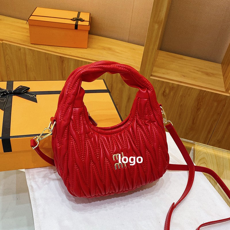 El nuevo bolso de nube plisado de MIU, bolso de mano, bolso de axila, moderno y versátil, bolso de hombro de cuero suave femenino