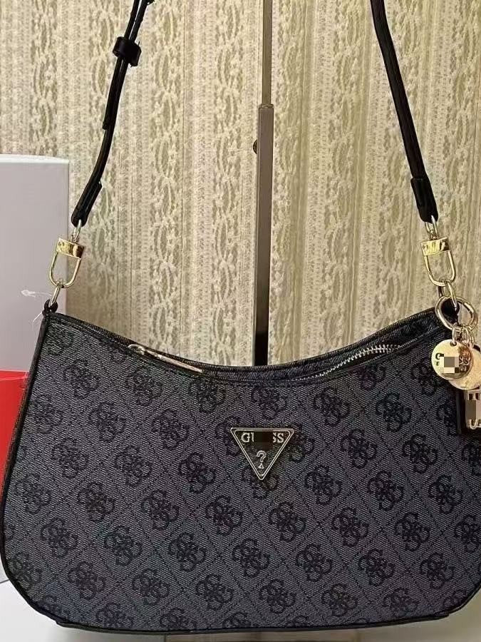 GS Adivina el nuevo bolso europeo y americano sencillo de un solo hombro con viento cruzado y de forma de brazo cruzado, bolso de bolita de color sólido bolso de luna creciente