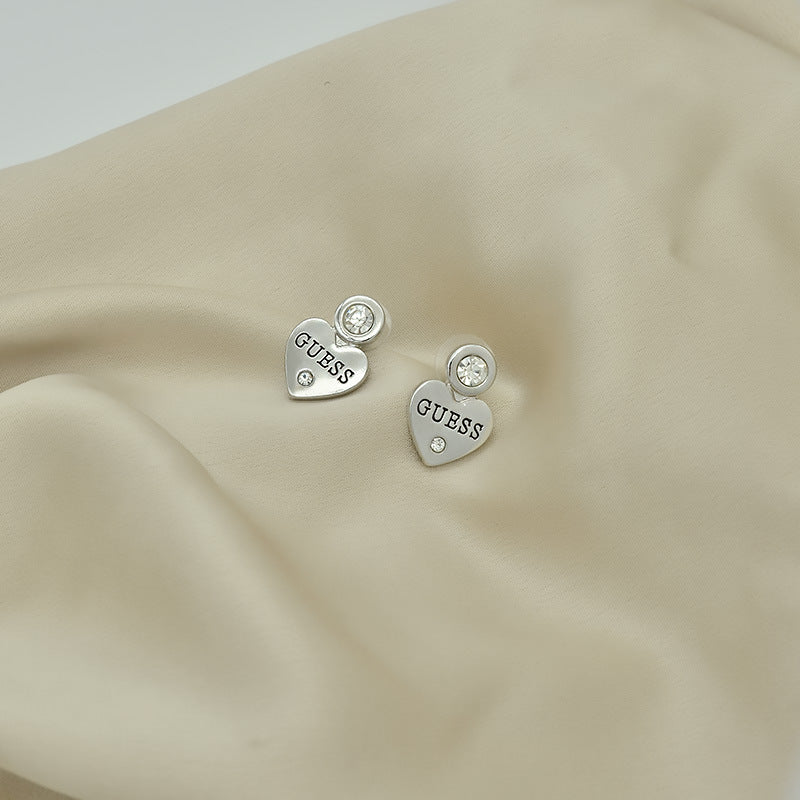 Letras incrustadas de corazón melocotón europeas y estadounidenses exportan, pendientes sencillos de pendientes para mujer, elegancia de nicho