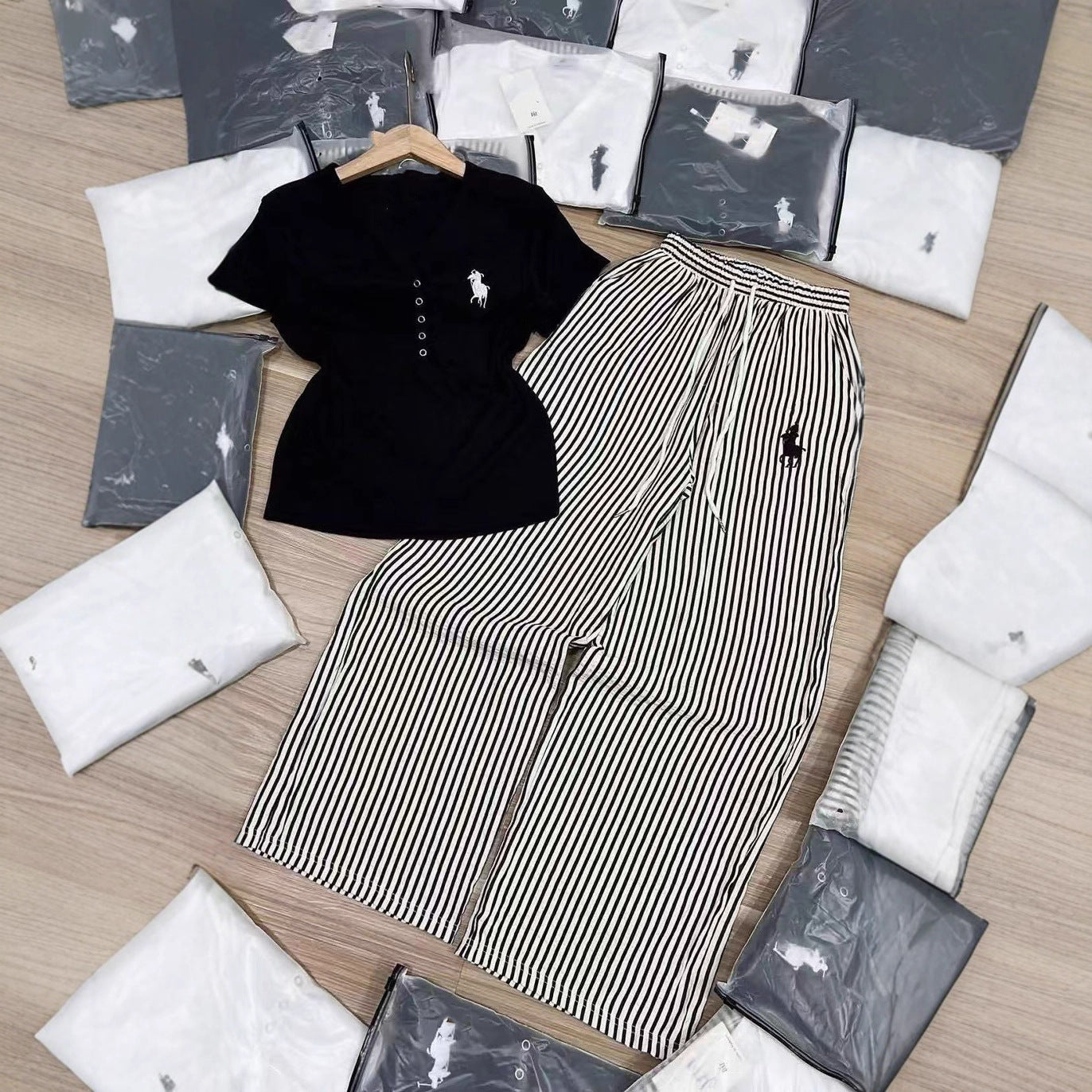 Conjunto de moda de comercio exterior para verano femenino, nuevo diseño con bordado en V con escote en V, pantalones de manga corta a rayas y pierna ancha de dos piezas