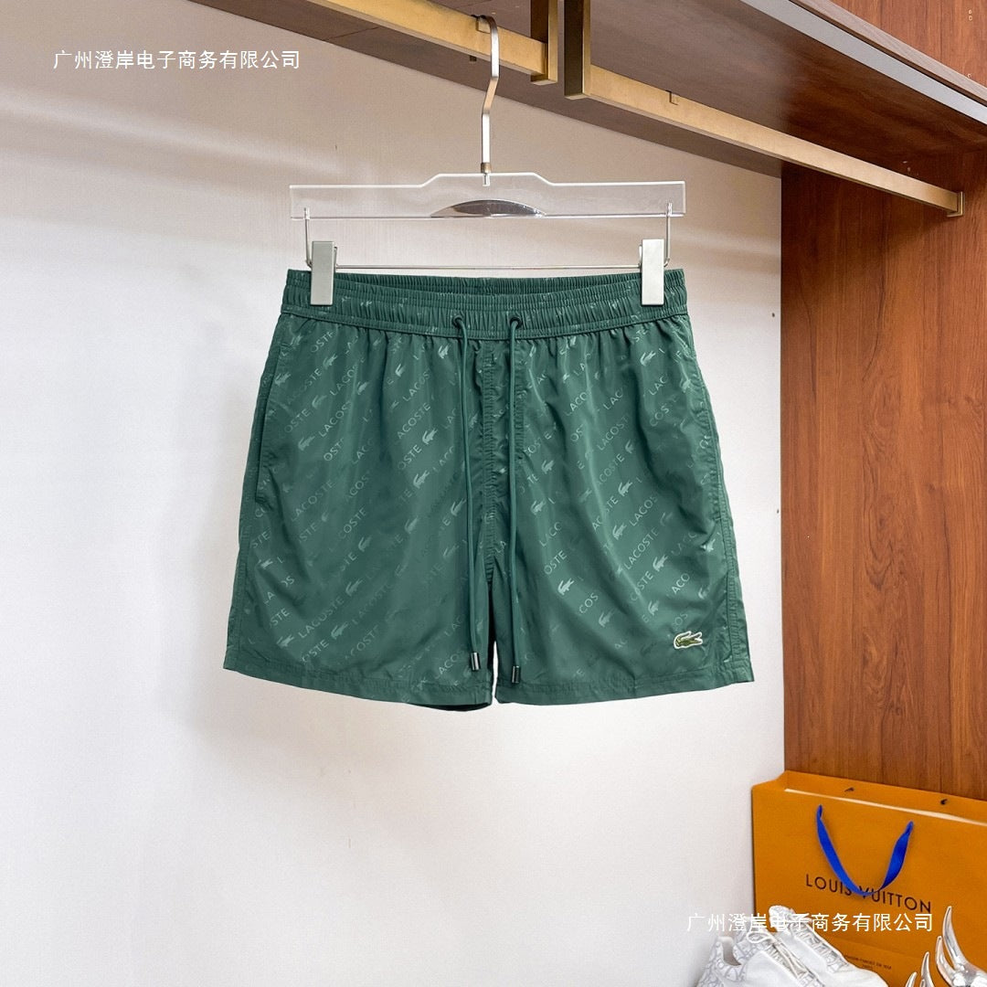 Nuevos pantalones cortos de playa para verano, pantalones deportivos casuales de secado rápido, estilo masculino holgado en stock, otras marcas
