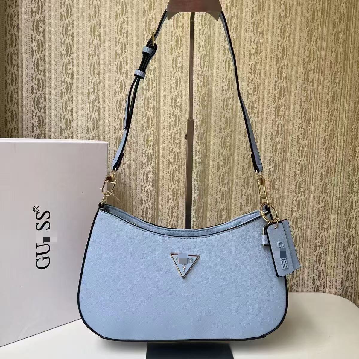 GS Adivina el nuevo bolso europeo y americano sencillo de un solo hombro con viento cruzado y de forma de brazo cruzado, bolso de bolita de color sólido bolso de luna creciente