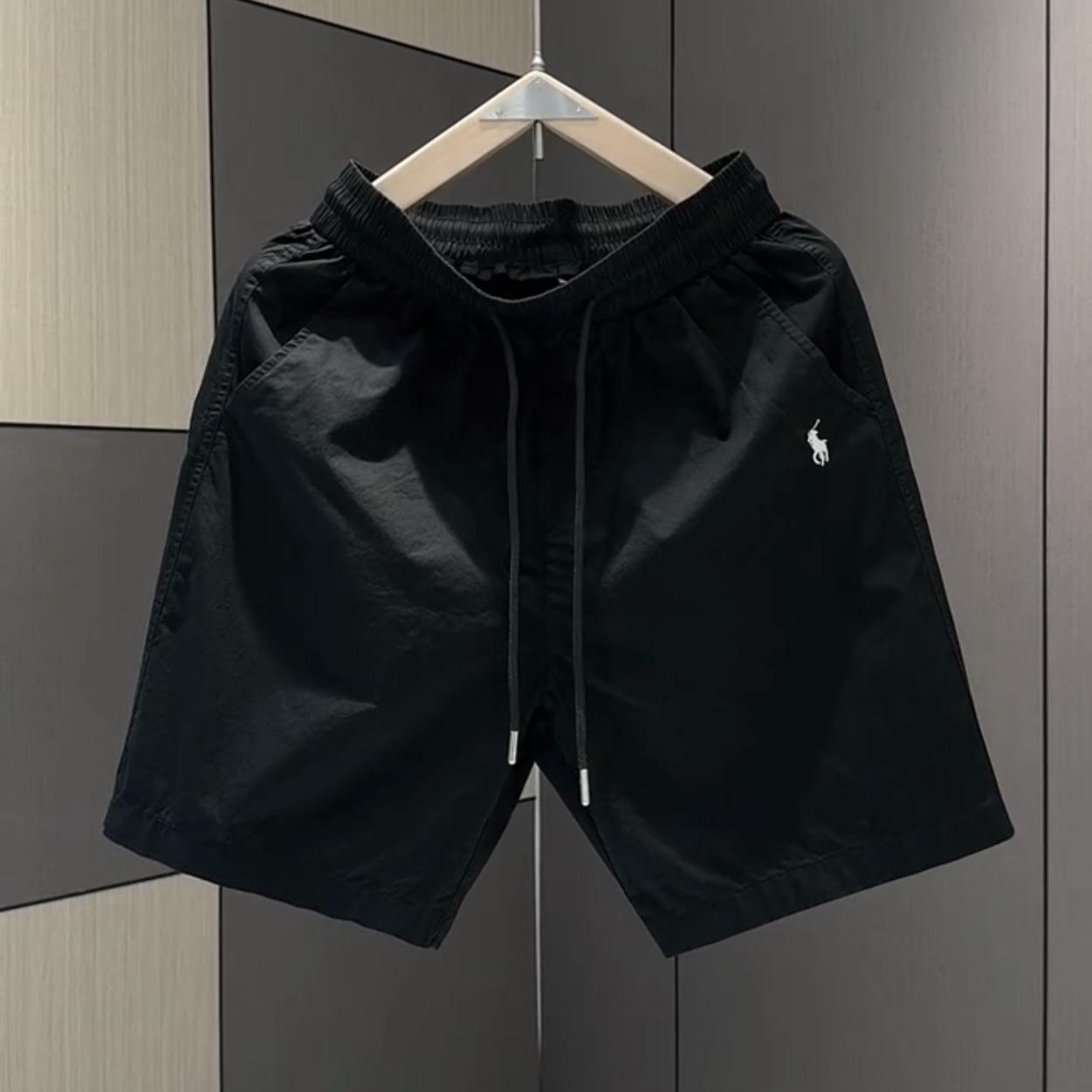 Nuevos pantalones cortos casuales masculinos de verano 2025, pantalones deportivos de playa de secado rápido y pierna recta holgados, pantalones versátiles americanos de cinco puntos