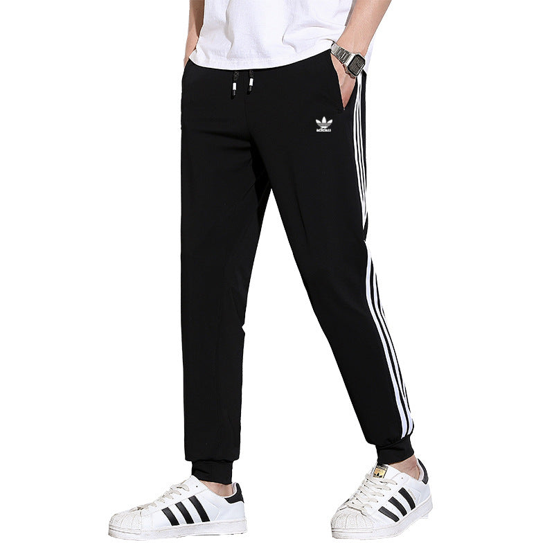 Pantalones deportivos de seda hielo de tres rayas para hombres y mujeres, pantalones finos casuales de verano, pantalones transpirables de alta elasticidad y secado rápido para hombres