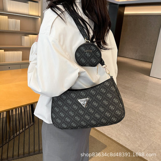 Comercio exterior al por mayor, bolso retro GS Guesser europeo y americano, bolso de hombro de moda de suegra con estampado transfronterizo