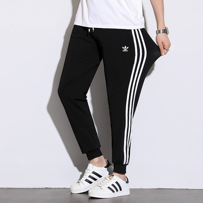 Pantalones deportivos de seda hielo de tres rayas para hombres y mujeres, pantalones finos casuales de verano, pantalones transpirables de alta elasticidad y secado rápido para hombres