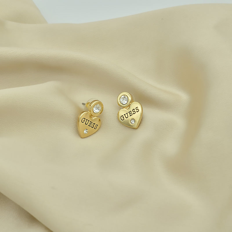 Letras incrustadas de corazón melocotón europeas y estadounidenses exportan, pendientes sencillos de pendientes para mujer, elegancia de nicho