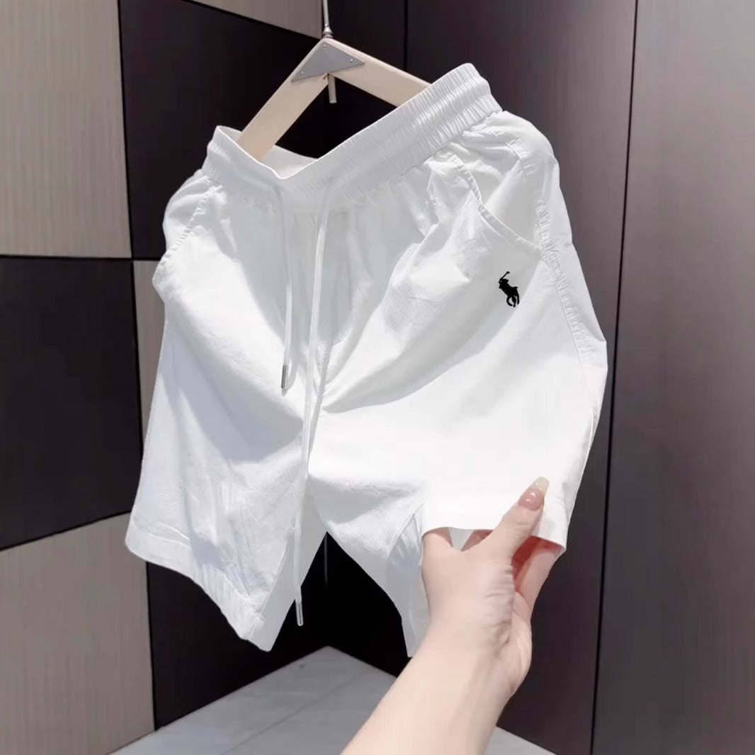 Nuevos pantalones cortos casuales masculinos de verano 2025, pantalones deportivos de playa de secado rápido y pierna recta holgados, pantalones versátiles americanos de cinco puntos