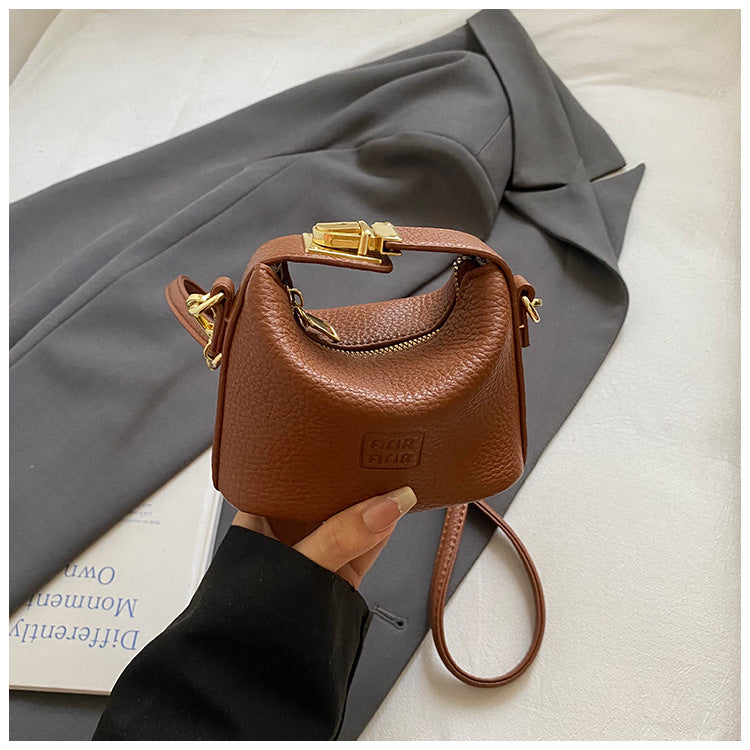 2025 Otoño Nuevo Nicho Bolso de Mano de Color Liso Alta Estética Casual Mono de Cuero Suave de Hombro Bandolera Bolso Pequeño Cuadrado