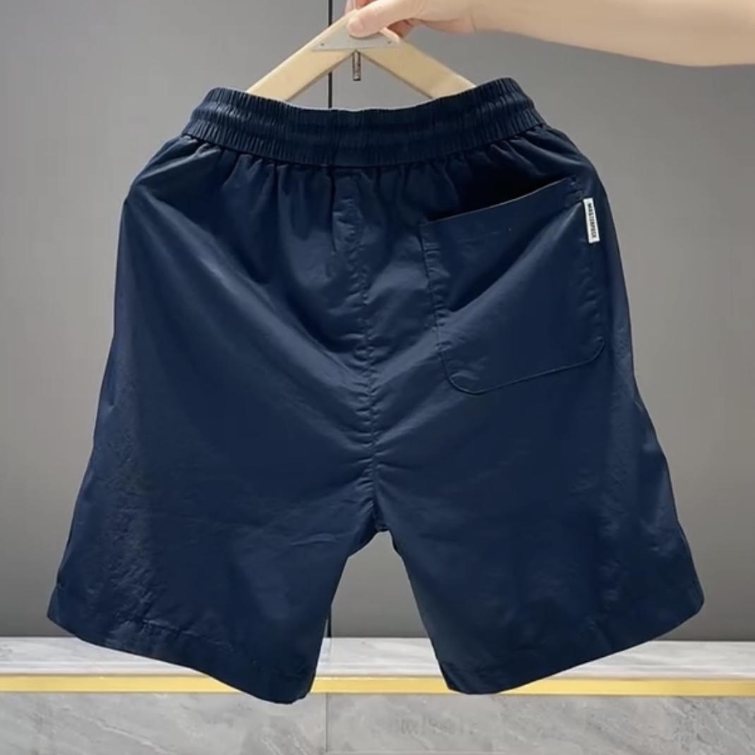 Nuevos pantalones cortos casuales masculinos de verano 2025, pantalones deportivos de playa de secado rápido y pierna recta holgados, pantalones versátiles americanos de cinco puntos