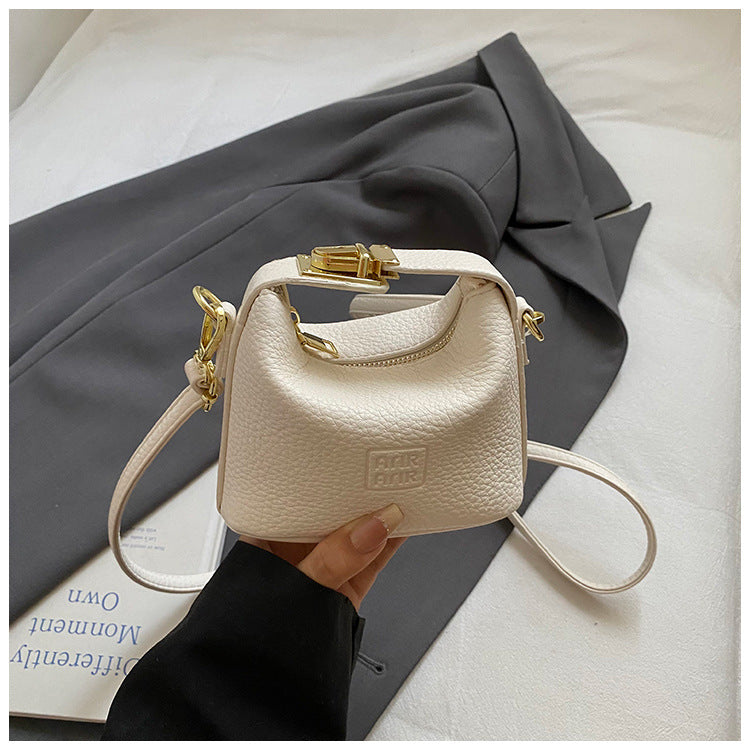 2025 Otoño Nuevo Nicho Bolso de Mano de Color Liso Alta Estética Casual Mono de Cuero Suave de Hombro Bandolera Bolso Pequeño Cuadrado